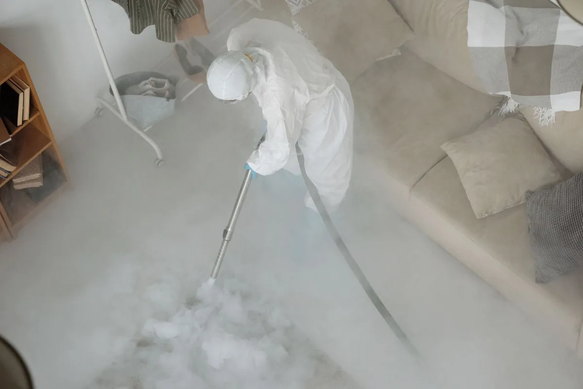 Biohazard cleanup technician in protective equipment, Soquel, CA